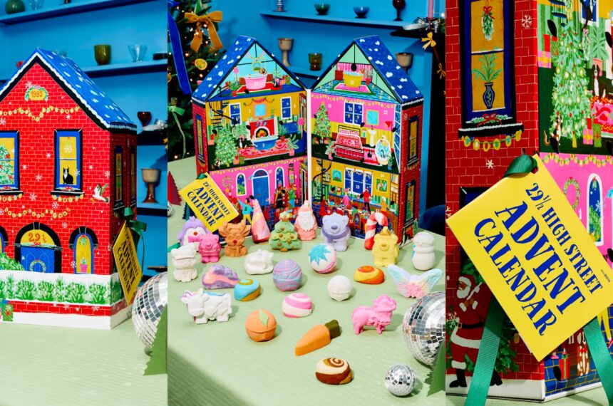 The Lush 29½ High Street Advent Calendar 2026: two illustrated house-shaped calendars with the bath bombs and bubble bars laid out in front of them