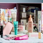 The Anthropologie 12 Days of Beauty Advent Calendar 2026 open with all thirteen products arranged in front of it