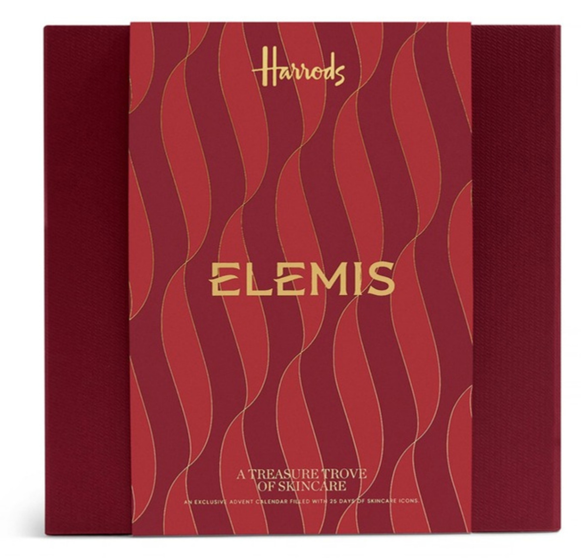 The closed Elemis A Treasure Trove of Skincare Advent Calendar box in deep red with gold waves and the Harrods and Elemis names on the front