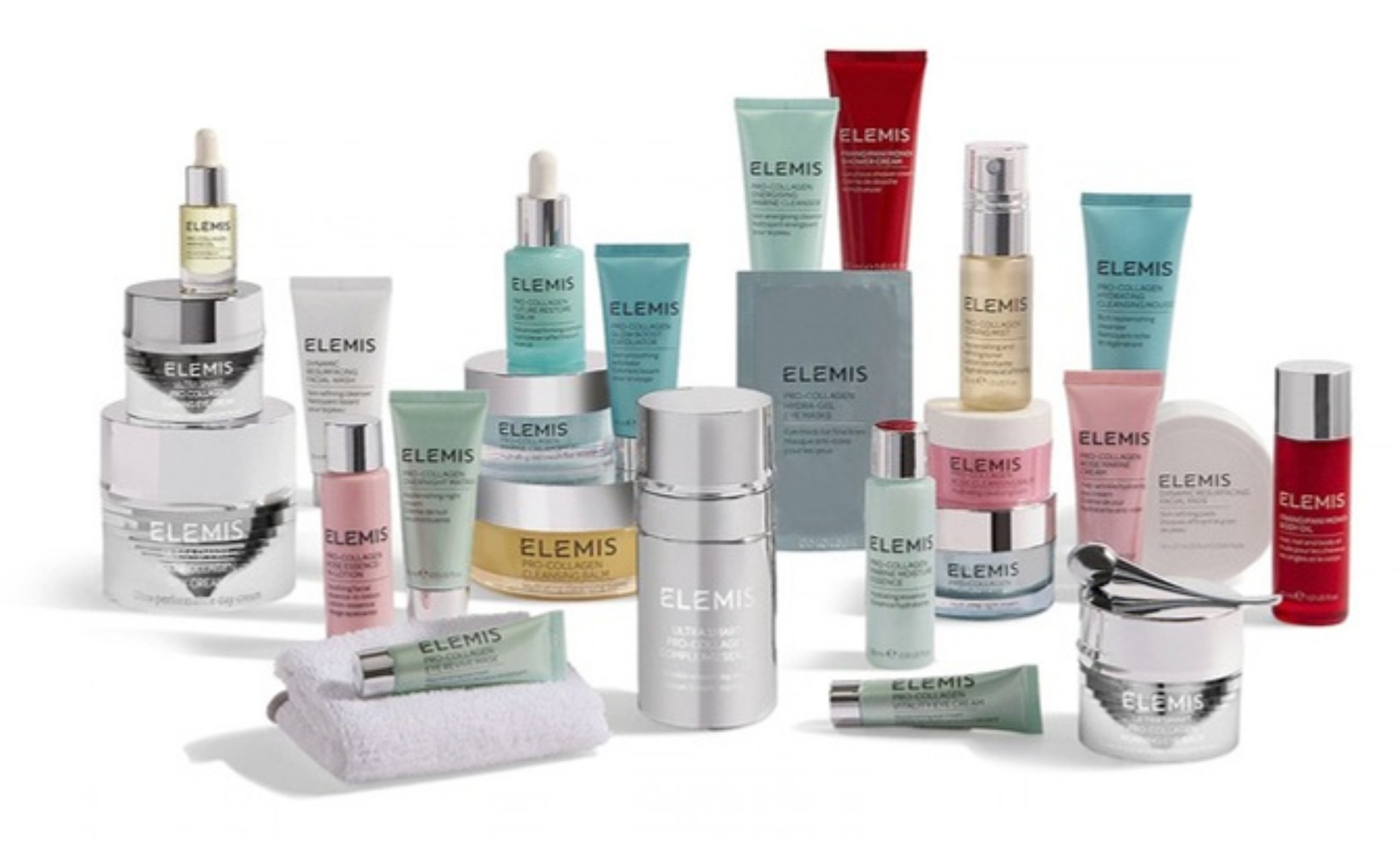 The contents of the Elemis Treasure Trove advent calendar laid out together, including the Pro Collagen Cleansing Balm, Ultra Smart Pro Collagen Day Cream and a cleansing cloth