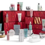 The Elemis A Treasure Trove of Skincare Advent Calendar 2026 open, with its Pro-Collagen and Ultra Smart products arranged in front of and on top of the red drawers