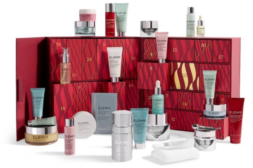 The Elemis A Treasure Trove of Skincare Advent Calendar 2026 open, with its Pro-Collagen and Ultra Smart products arranged in front of and on top of the red drawers