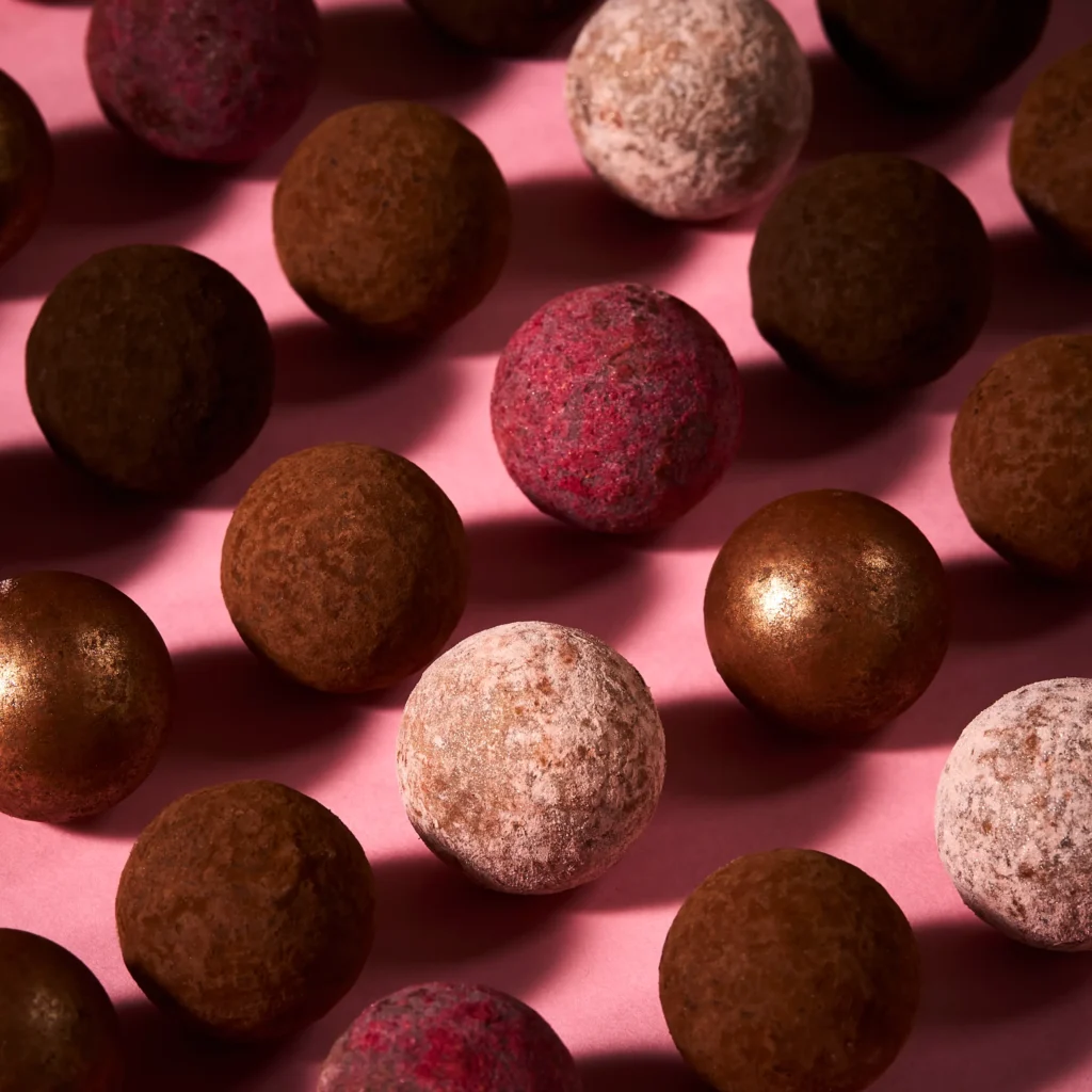 Close-up of the truffles from the Fortnum’s Favourites Truffle Advent Calendar 2026, showing the range of dusted and glazed finishes.