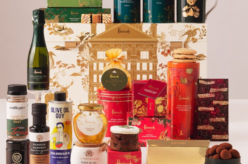 Harrods Food Halls Advent Calendar 2026 with all 25 items arranged around the gold Harrods building calendar box