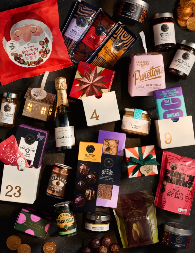Overhead flat-lay of all 27 products in the M&S Foodhall Advent Calendar 2026