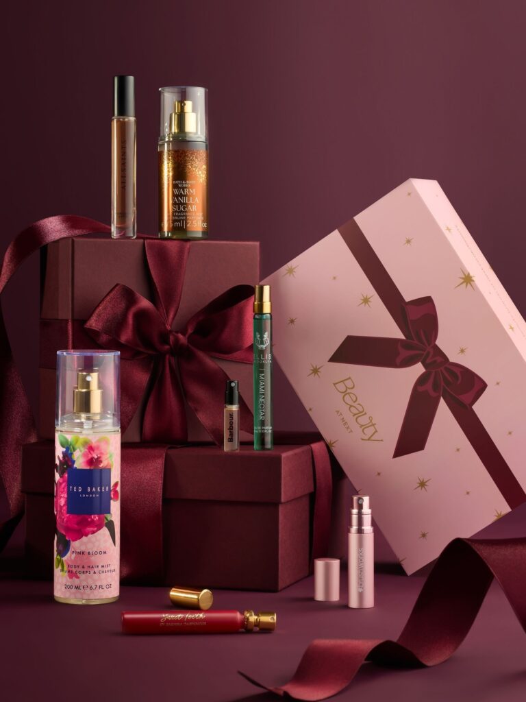 Next The Christmas Fragrance Edit Sweet Gourmand 2026 gift boxes with the Ted Baker mist, Warm Vanilla Sugar mist and perfume minis in front of them