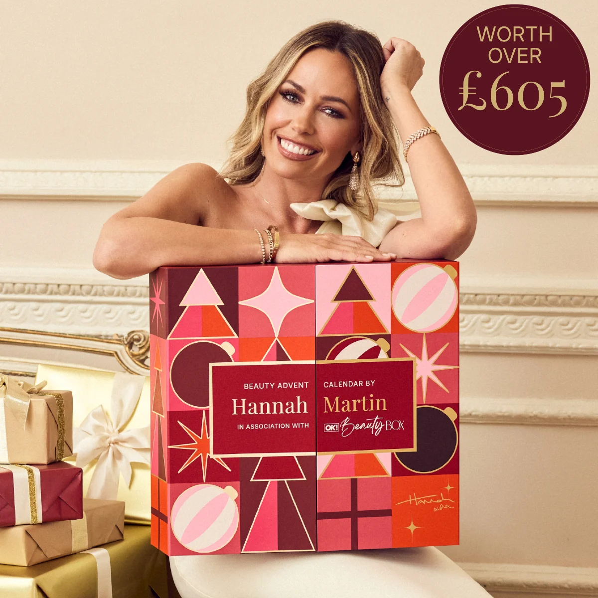 Make-up artist Hannah Martin holding the red OK! Beauty Box Advent Calendar 2026 she curated
