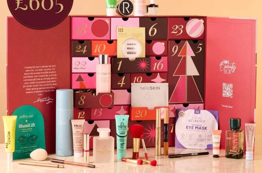 The OK! Beauty Box Advent Calendar 2026 open, with its 25 makeup and skincare products displayed in front of the red calendar