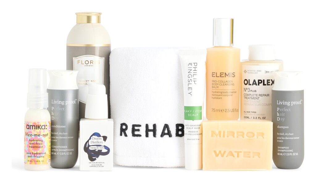 The products from the Selfridges Everything Shower Kit lined up, including the REHAB. hair towel and Olaplex No.3 Plus
