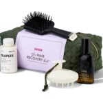 The Space NK Hair Recovery Kit 2026 with its quilted bag, ghd paddle brush, scalp massager and haircare products