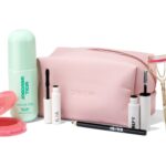 The Space NK Your Makeup Must-Haves 2026 set with its blush pink washbag, Rare Beauty blush, ILIA mascara and eyelash curler