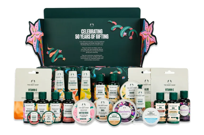 The Body Shop Classic Beauty Advent Calendar 2026 green box open with all 24 travel-size body butters, shower gels, hand creams and sheet masks arranged in front