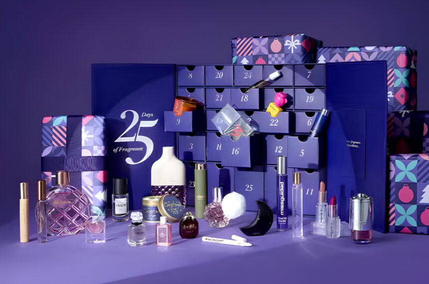 The Fragrance Shop Women's Advent Calendar 2026 open, with its fragrances, candles and extras displayed in front