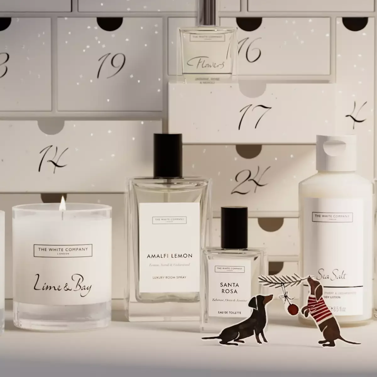 Products from The White Company Advent Calendar 2026 including the Signature Candle, both eaux de toilette and the Sea Salt body lotion