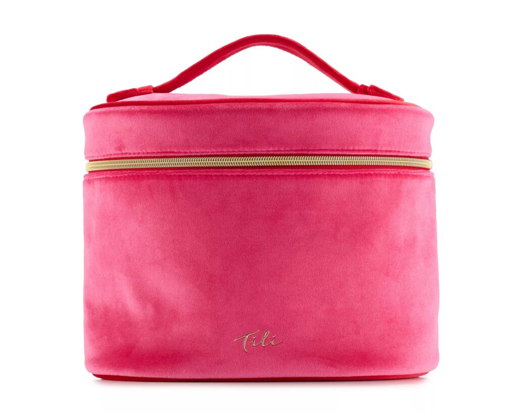 The pink velvet Tili vanity case with a gold zip, included in the Tili Luxe Beauty Edit 2026
