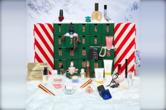 Fenwick Beauty Advent Calendar 2026 open with its numbered drawers, surrounded by the beauty products and fragrances inside